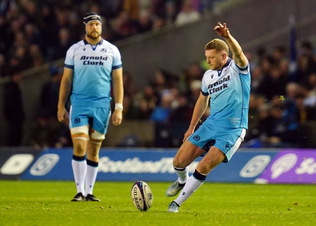 Finn Russell kicks a penalty for Scotland