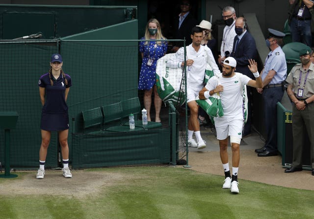 The players walk out on Centre Court to applause