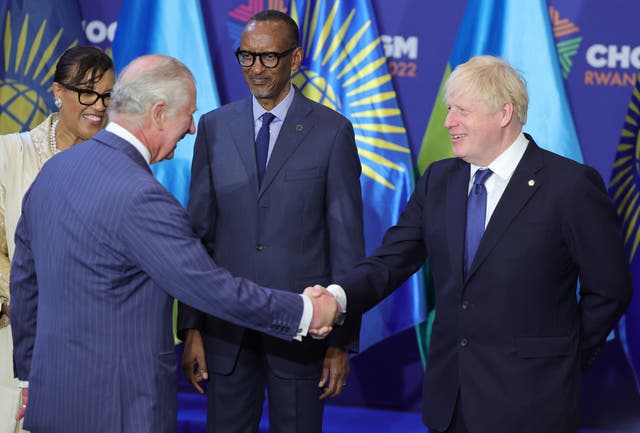 The Prince of Wales and the Prime Minister shake hands as they attend the Commonwealth Heads of Government Meeting 