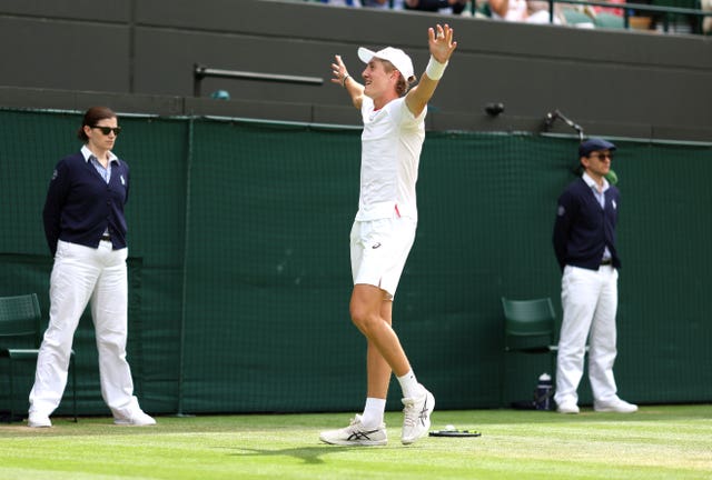 Henry Searle celebrates his victory against Yaroslav Demin on Court One 