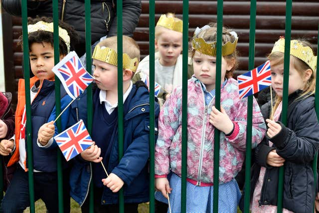 Schoolchildren wait for the Duchess's arrival at Oxford's Pegasus Primary School (Arthur Edwards/The Sun/PA)