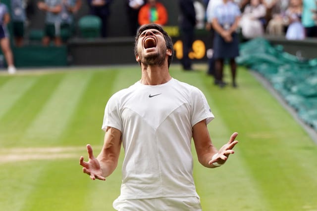 Carlos Alcaraz celebrates beating Novak Djokovic at Wimbledon