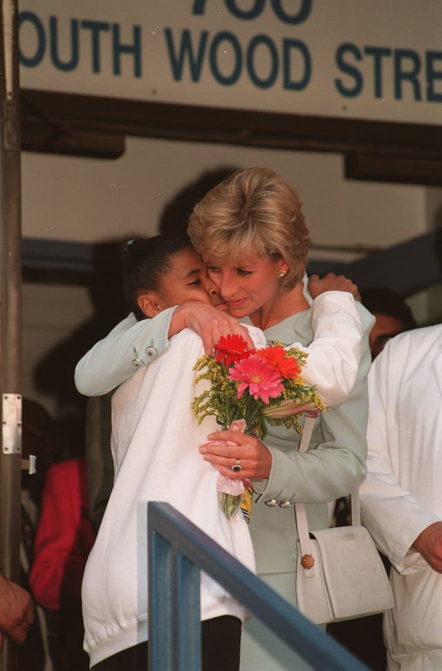 Princess of Wales Hugs Girl 