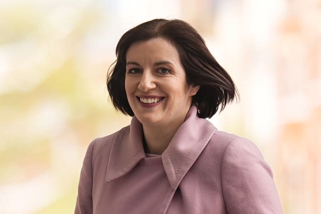 Bridget Phillipson smiling while walking outside