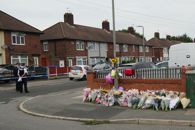 Flowers are left near the scene of Olivia's murder in Kingsheath Avenue, Knotty Ash, Liverpool (Peter Byrne/PA)