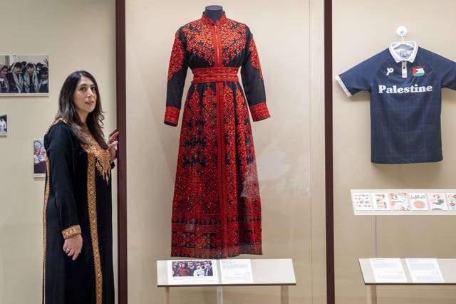 Nadia El-Nakla standing next to a red dress