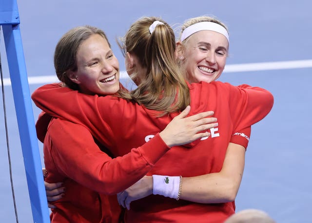 Jil Teichmann (right) celebrates her win with team-mates