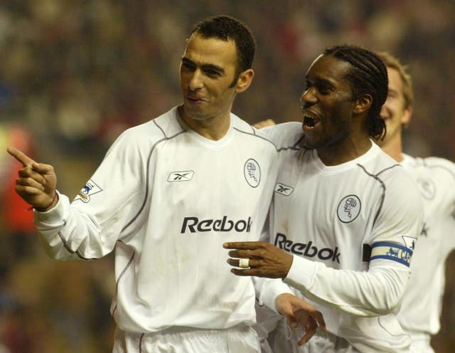 Bolton's Youri Djorkaeff, left, and Jay-Jay Okocha celebrate a goal against Liverpool