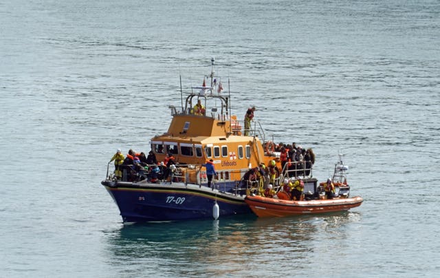 A group of people thought to be migrants are brought in to Dover, Kent, onboard the RNLI Dover Lifeboat 