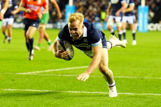 Arron Reed roars in delight as he dives to score Scotland’s eighth try against Portugal