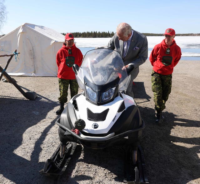Charles tries a snowmobile with the Canadian Rangers at Fred Henne Territorial Park in Yellowknife, Canada
