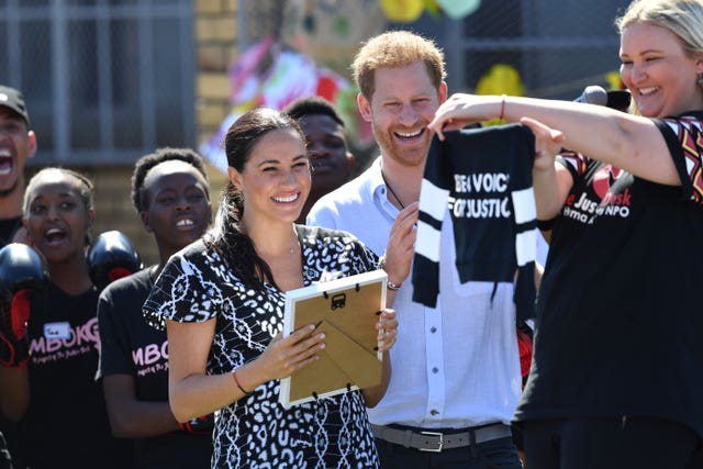 The Duke and Duchess of Sussex are presented with a gift for son Archie