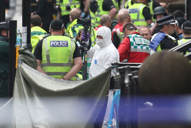 Police and forensic officers at the scene in West George Street, Glasgow