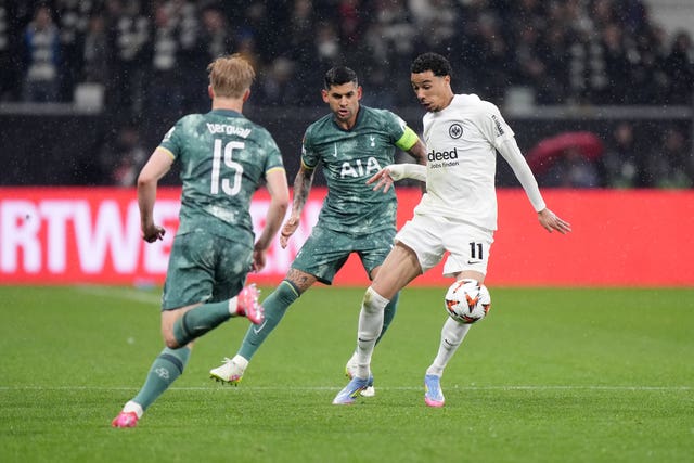 Eintracht Frankfurt’s Hugo Ekitike, right, controls the ball under pressure from Tottenham’s Cristian Romero