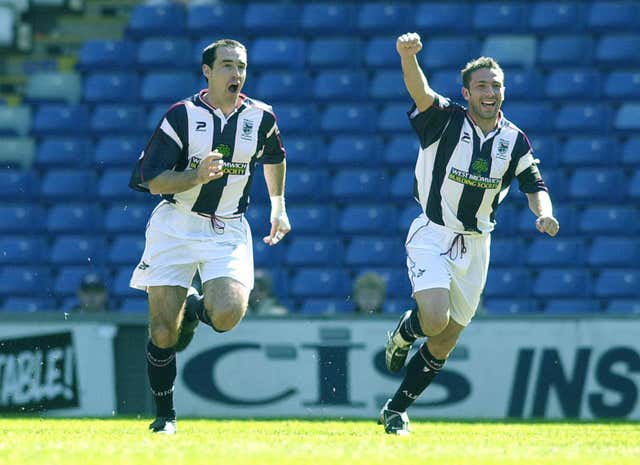 Derek McInnes, right, celebrates during a West Brom game