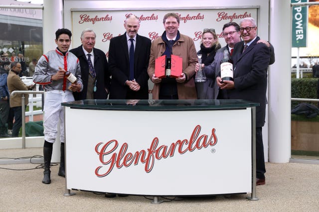 Jockey Felix de Giles (left) and trainer Gabriel Leenders (centre) celebrate victory in the Glenfarclas Cross Country Handicap Chase 