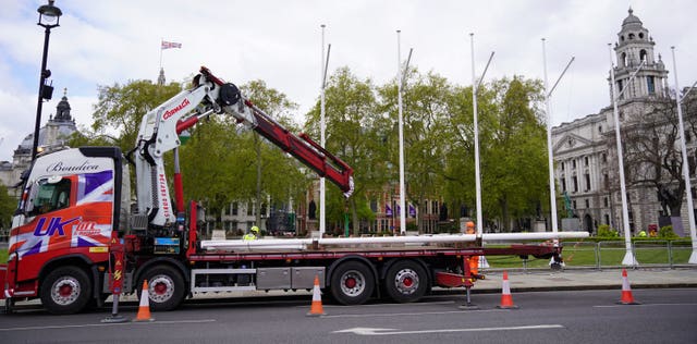 Flagpoles were erected in Parliament Square ahead of the traditional State Opening of Parliament