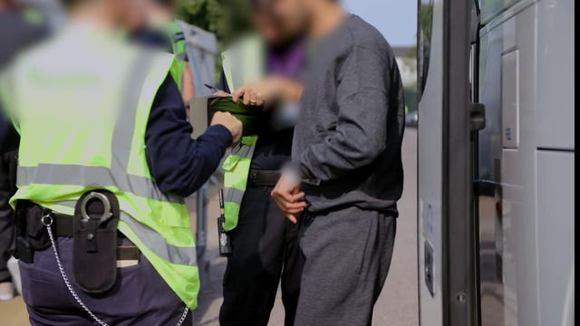 Border Force officers processing people at Manston 