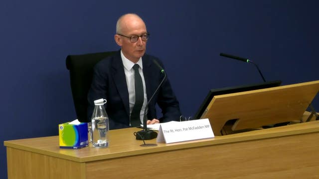 Pat McFadden giving evidence at a wooden desk