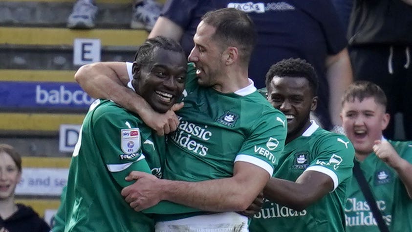 Mustapha Bundu (left) celebrates scoring Plymouth’s third goal (Andrew Matthews/PA)