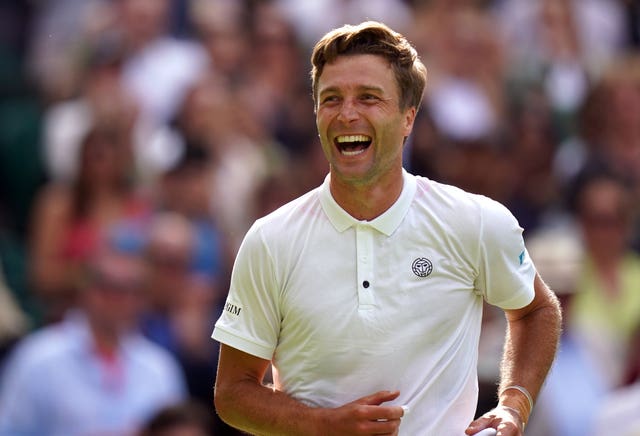 Liam Broady celebrates victory over Casper Ruud at Wimbledon