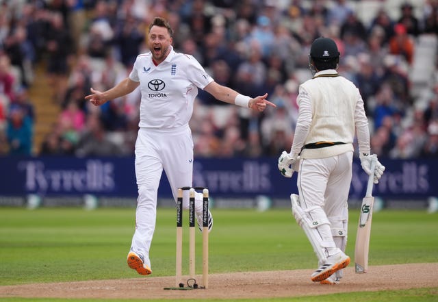 Ollie Robinson celebrates the wicket of Saim Ayub 