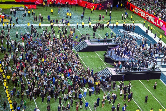 People on the pitch at the Super Bowl