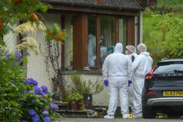 Forensic officers outside house