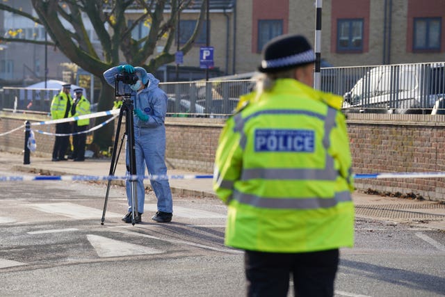 Police officers on a street in Hackney following a shooting