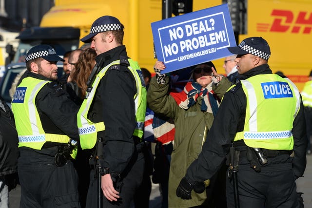 Police stand near pro-Brexit supporters outside Parliament