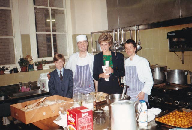 William and Diana in a charity's kitchen with chefs when William was a boy