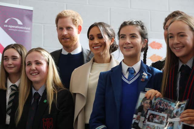 Harry and Meghan Markle with school children in Lisburn (Niall Carson/PA)