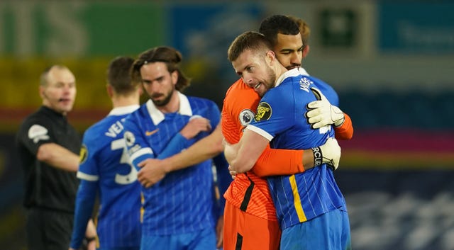 Brighton's players hugged on the pitch at the end of their 1-0 win over Leeds.