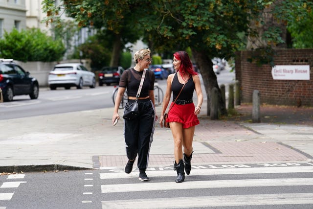 Strictly Come Dancing professional dancers Amy Dowden (left) and Dianne Buswell cross a road