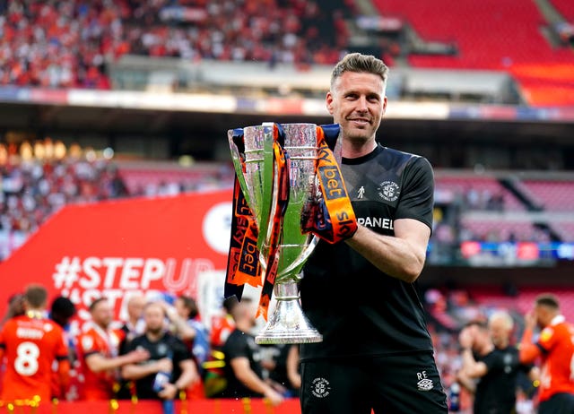 Rob Edwards holds the Championship play-off final trophy