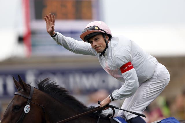 William Buick celebrates winning the Sky Bet Ebor on Ethical Diamond 