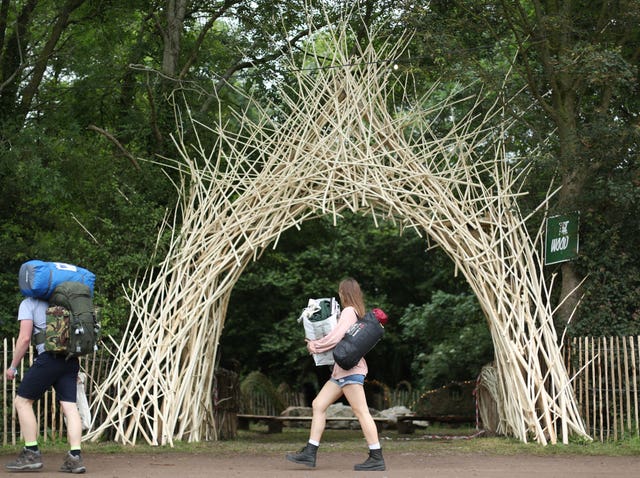 People arrive on the first day of Glastonbury Festival at Worthy Farm, Somerset 