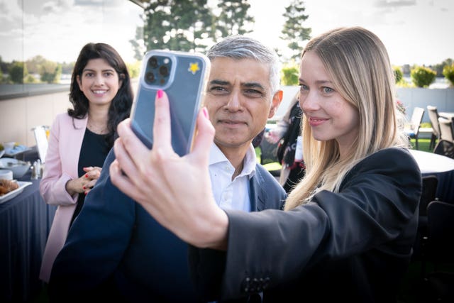 Mayor of London Sadiq Khan poses for a selfie 