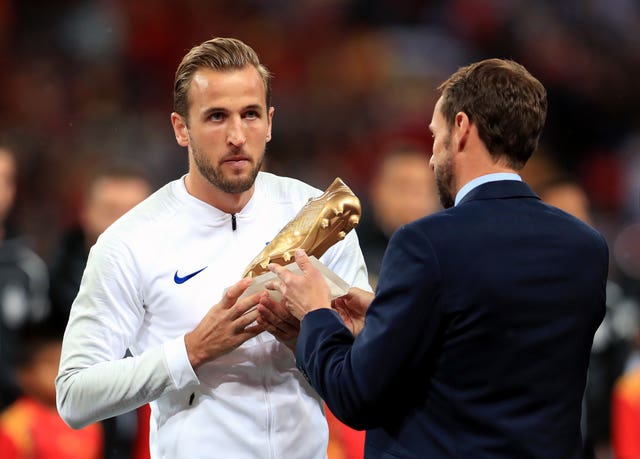 England manager Gareth Southgate, right, presents Harry Kane with the 2018 World Cup Golden Boot