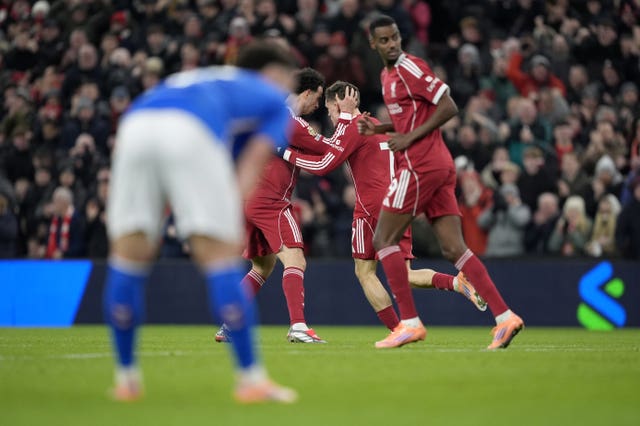 Florian Wirtz, centre, celebrates with Curtis Jones after Liverpool's goal against Sunderland, with Alexander Isak seen in the foreground