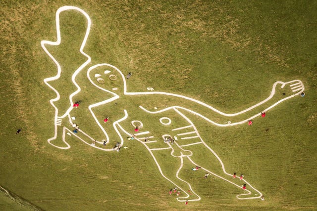 The Cerne Abbas giant was re-chalked by conservationists last year (Ben Birchall/PA).