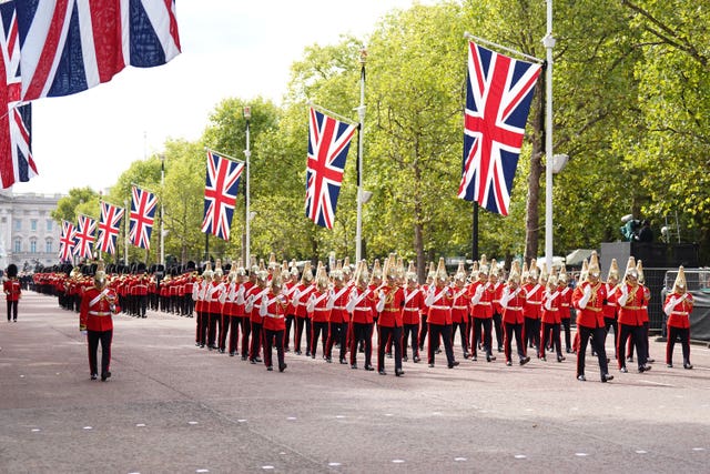 The coffin is carried on a horse-drawn gun carriage of the King’s Troop Royal Horse Artillery