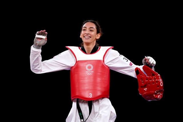 Kimia Alizadeh celebrates her victory over defending Olympic champion Jade Jones