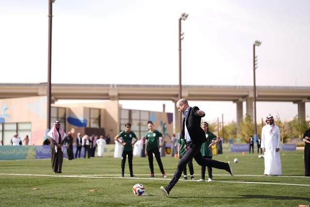 The Prince of Wales takes a penalty shot during a visit to MISK Sports City in Riyadh, to learn about the increasing role of women in society and particular their growing participation in sport, on day two of his visit to the Kingdom of Saudi Arabia