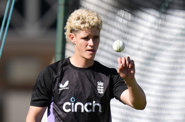 Jacob Bethell tosses a white ball at England's net session at Trent Bridge.