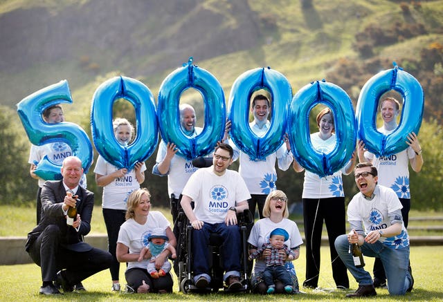 Gordon Aikman and campaigners celebrate raising half a million pounds for MND research in 2016 (Jane Barlow/PA)