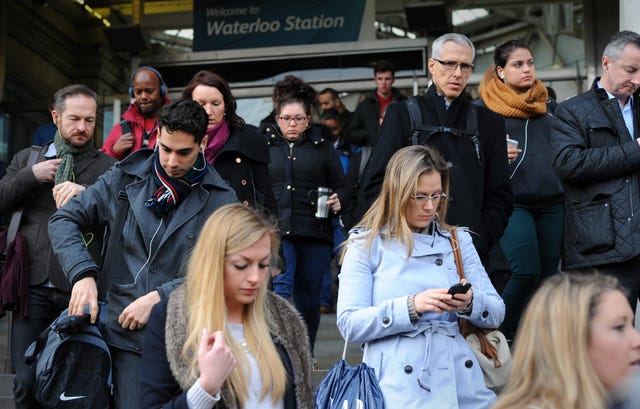 Commuters leaving a railway station 