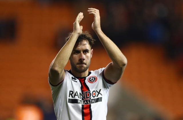 George Baldock applauding 