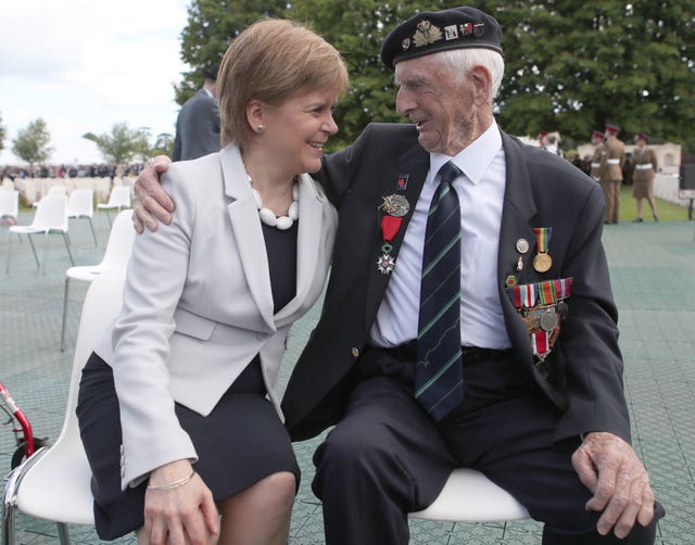 Scottish First Minister Nicola Sturgeon with D-Day veteran John Greig, 95, from Dumfries, at the Commonwealth War Graves Commission Cemetery in Bayeux