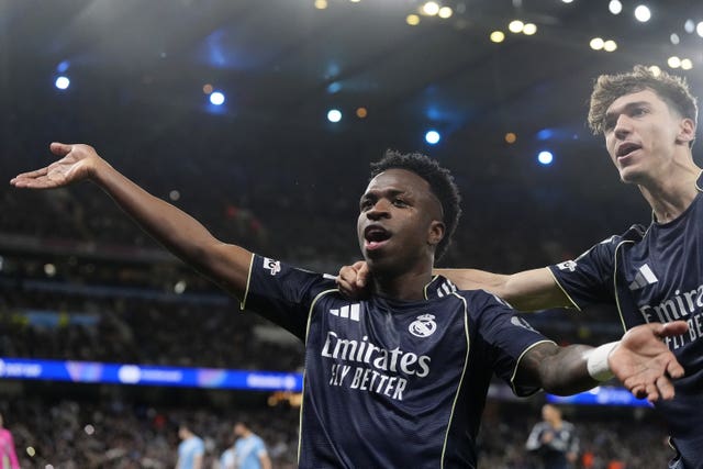 Real Madrid’s Vinicius Junior (left) celebrates scoring against Manchester City